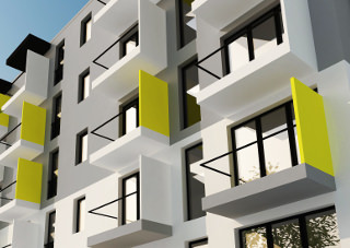 zbliżenie na elewację budynku mieszkalnego z kolorowymi balkonami autorstwa projektantów z amawa architekci z Wrocławia